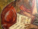 an image of a painting of an old man holding a book