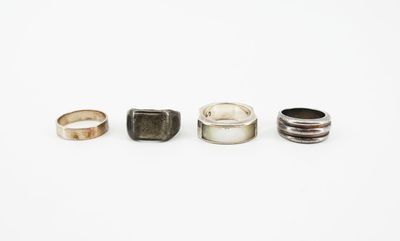 three different types of rings sitting on top of a white surface