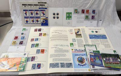 a table with a bunch of stamps and a book on it