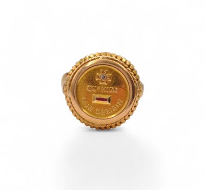 an image of a gold coin ring with a crown on it