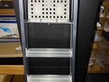 a metal shelf with a lot of shelves on top of it
