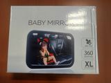the box of the baby mirror is open on the table
