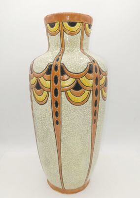 a vase that is sitting on a white surface