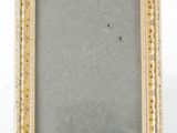 an old picture frame with a drawing of a bird on it