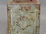 an old tin canister with a metal handle and a handle on it
