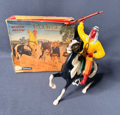 figurine of a man riding a horse with a spear in his hand