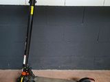 a scooter that is parked in front of a wall