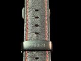 an image of a close up of a watch on a black background