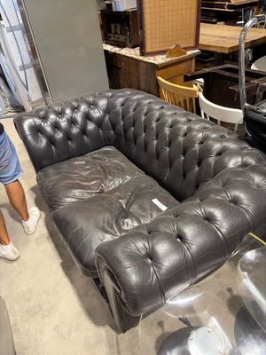 a man that is standing next to a couch