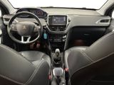 the interior of a small car with a steering wheel and dashboard