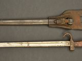 two old tools are sitting on a table next to each other