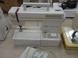several sewing machines are lined up on the floor in a room