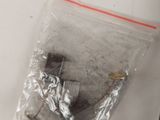 a plastic bag with a metal object inside of it
