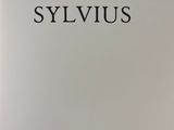the front cover of a book with a picture of a man in a suit