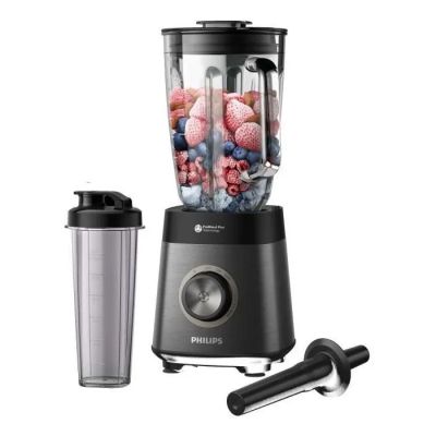 the blender has a blender and a blender with berries in it