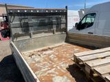 a truck bed that is sitting in the dirt