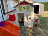 a little house that is sitting in the yard