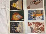 a picture of a collection of art cards on a table
