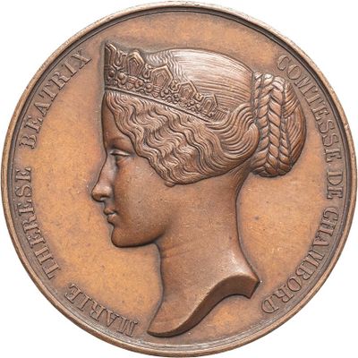 an image of a bronze medal with a woman ' s head on it