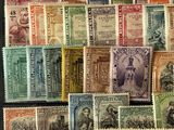 many different types of postage stamps are displayed in a display case