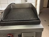 an image of a commercial grill in a commercial kitchen