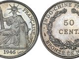 a silver coin with the image of a woman sitting on top of it