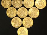 a group of gold coins arranged in the shape of a triangle