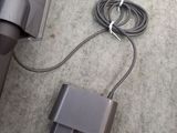 an image of a vacuum cleaner with a cord attached to it