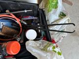 a suitcase full of tools and other items on the floor