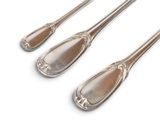 three silver spoons with handles and handles on a white surface