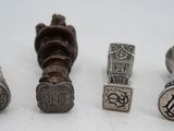 four different types of metal items on a white surface