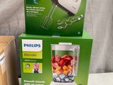 two boxes of philips blenders sitting on top of a table