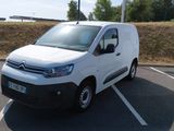 a white van that is parked in a parking lot