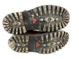 pair of old hiking boots on a white background