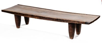 a small wooden bench that is sitting on a white surface