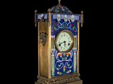 a clock that is sitting on a stand on a black background