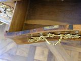 a wooden table with a drawer on top of it