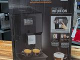 krups coffee machine in the box on a wooden table