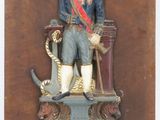 a statue of a man in a military uniform on a pedestal