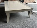 a coffee table that is sitting on the ground