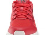 a close up view of a red shoe with a white sole