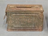two old tins sitting next to each other on a table