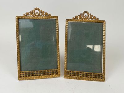 pair of antique gold picture frames with green glass in the middle