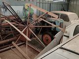 a truck that is parked next to a pile of wood