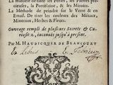 an old book with a black and white drawing on it