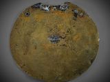 an image of a metal plate with rust on it