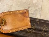 a luggage tag on top of a piece of luggage