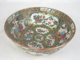 a bowl with a floral design on it sitting on a table