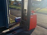 a forklift that is parked on the side of the road