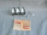 three spoons and two spoon spoons on a table